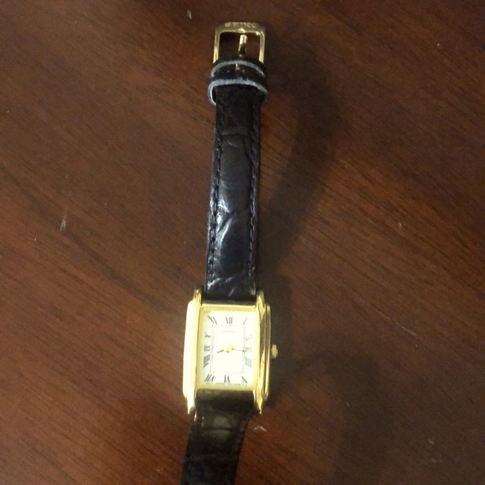 Gold tone Seiko watch with black leather strap